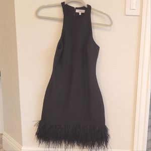 Likely black feather trim dress